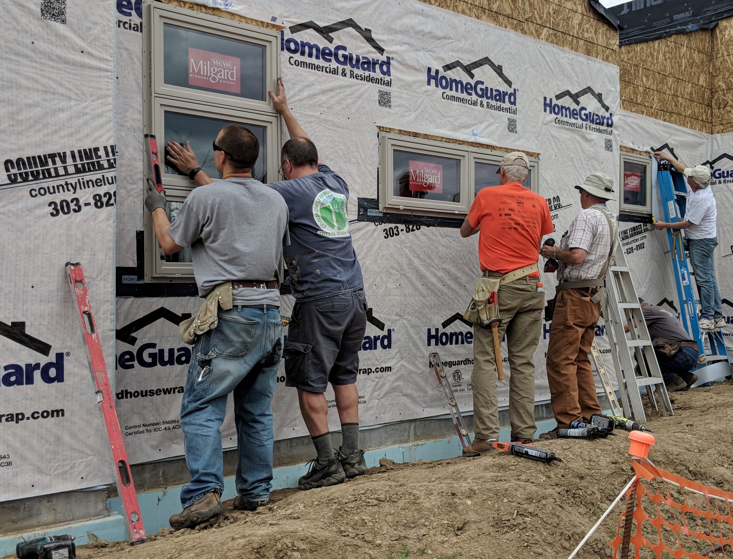 UCC Longmont Micah Homes window volunteers 2019