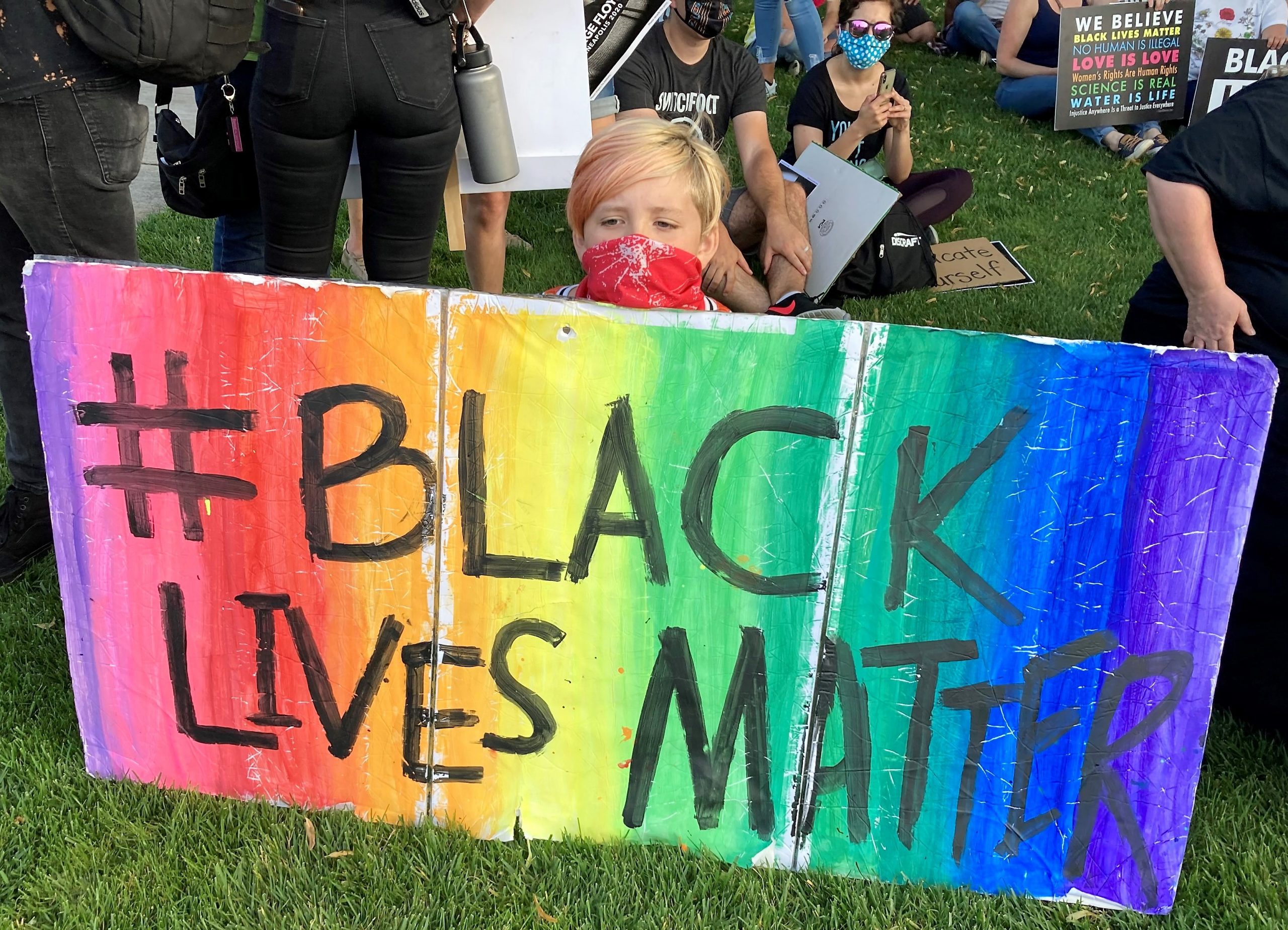 Young person from Milwaukie UCC with Black Lives Matter sign, 8/28/20