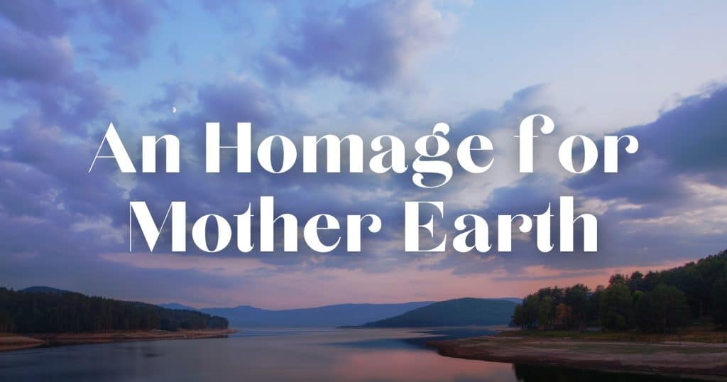 Looking out over a lake to the mountains with a sunset. Includes the words, “An Homage for Mother Earth”