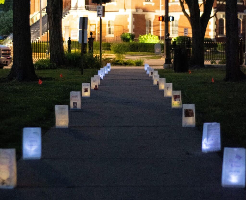 Luminaries line a park walkway.