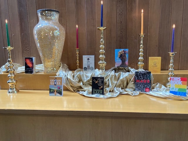 An altar of banned books and candles